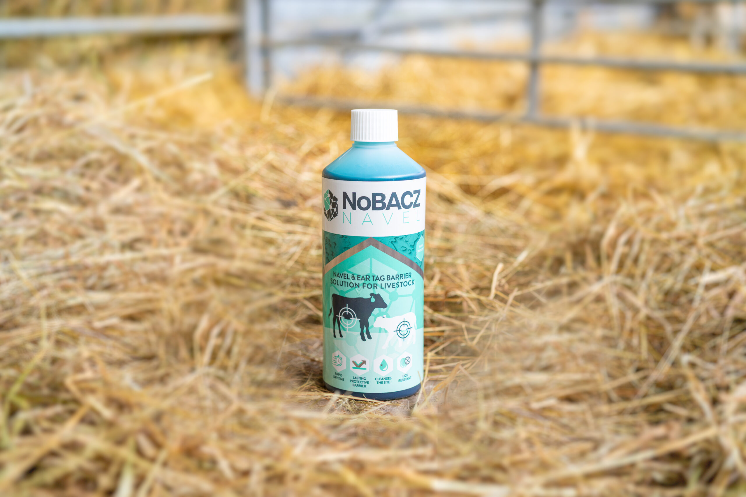 Image of NoBACZ navel product on bed of hay in a farm.